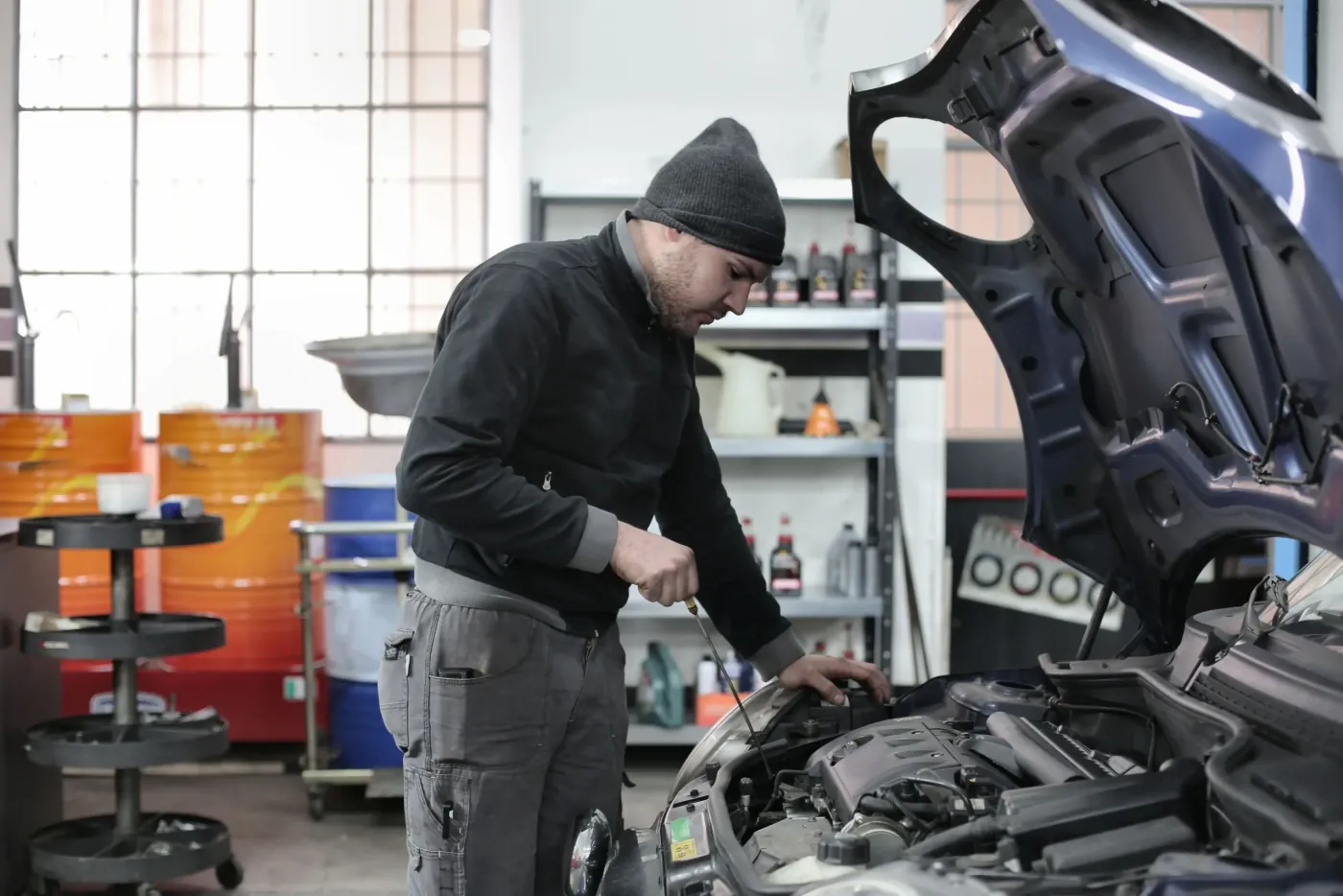 Javen Coughlin working under the hood in the Floorjack shop